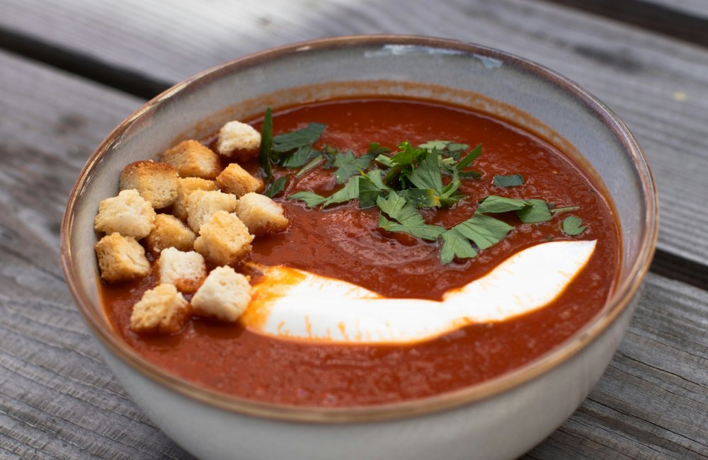 Cream of tomato soup made from fresh ripe tomatoes in sattvik style at Annakoot Restaurant